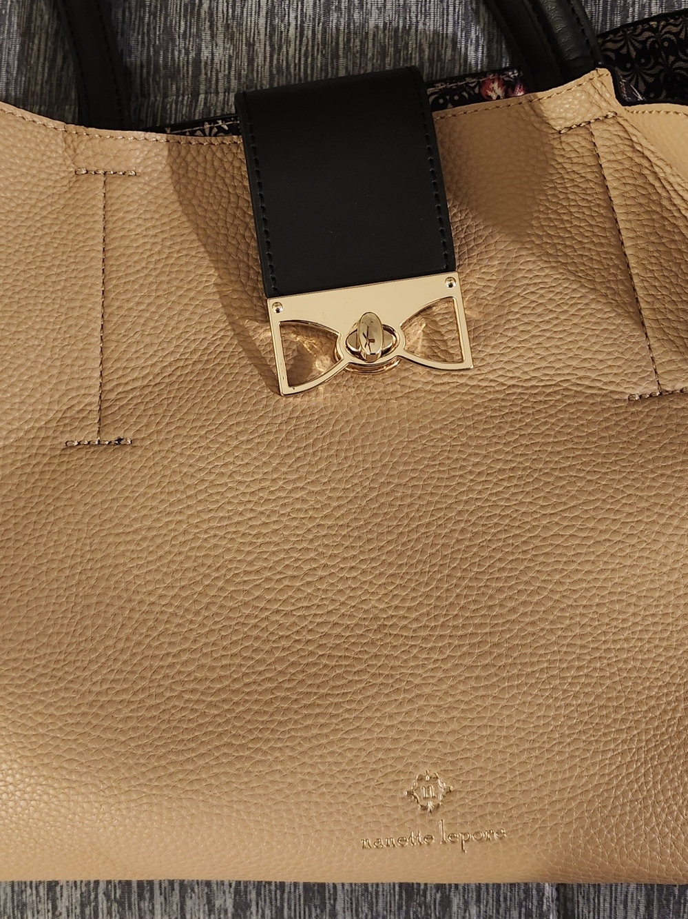 Nanette Lepore Tan and Black Pebbled Leather Tote with Gold Bow Lock